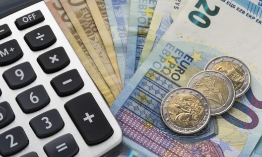 Close up of a calculator and euro money in a financial analyzing concept