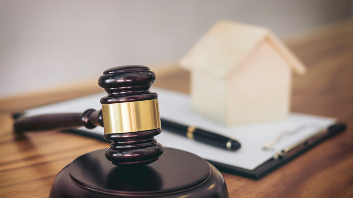 Gavel on sounding block at courtroom for decide home insurance, Law and justice concept, Settle a house dealing lawsuit.