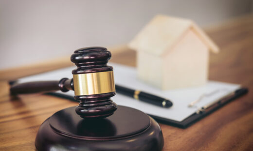 Gavel on sounding block at courtroom for decide home insurance, Law and justice concept, Settle a house dealing lawsuit.