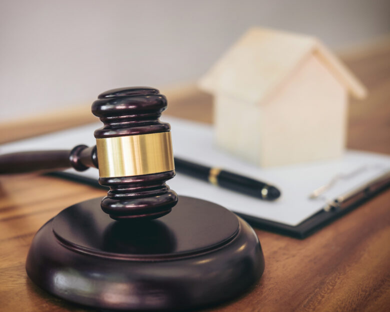 Gavel on sounding block at courtroom for decide home insurance, Law and justice concept, Settle a house dealing lawsuit.