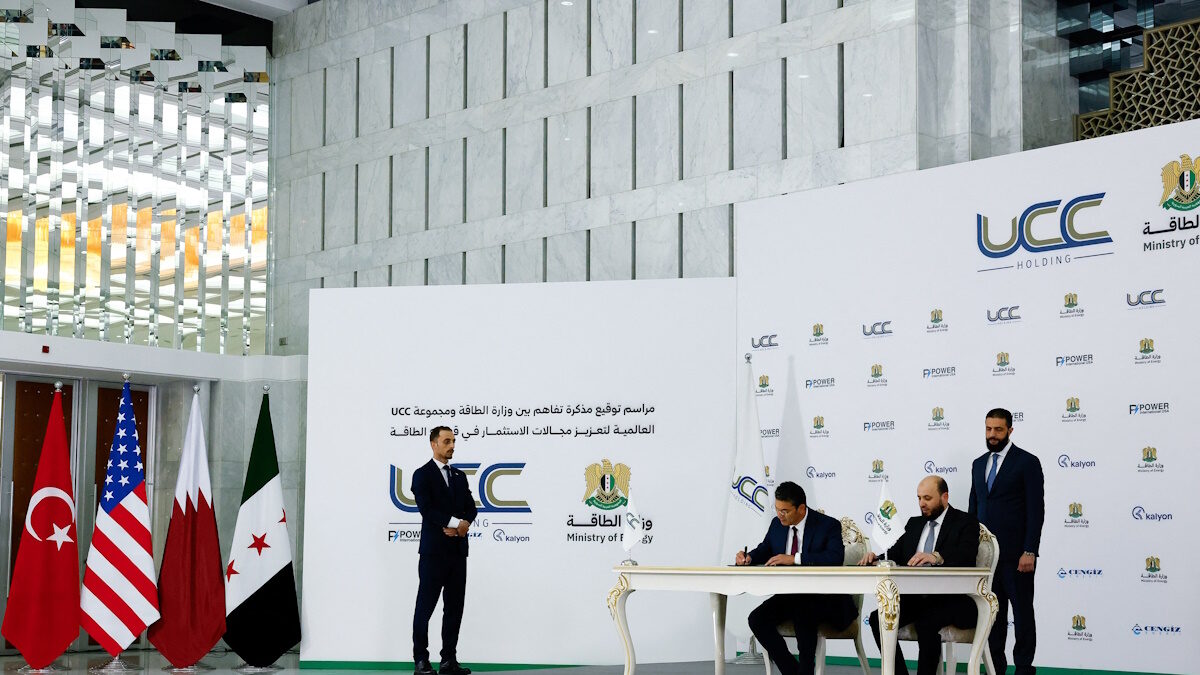 Syrian President Ahmed al-Sharaa attends the signing ceremony of a memorandum of understanding between the Ministry of Energy and Qatar's UCC Holding, with the aim of promoting investment in the energy sector, in Damascu