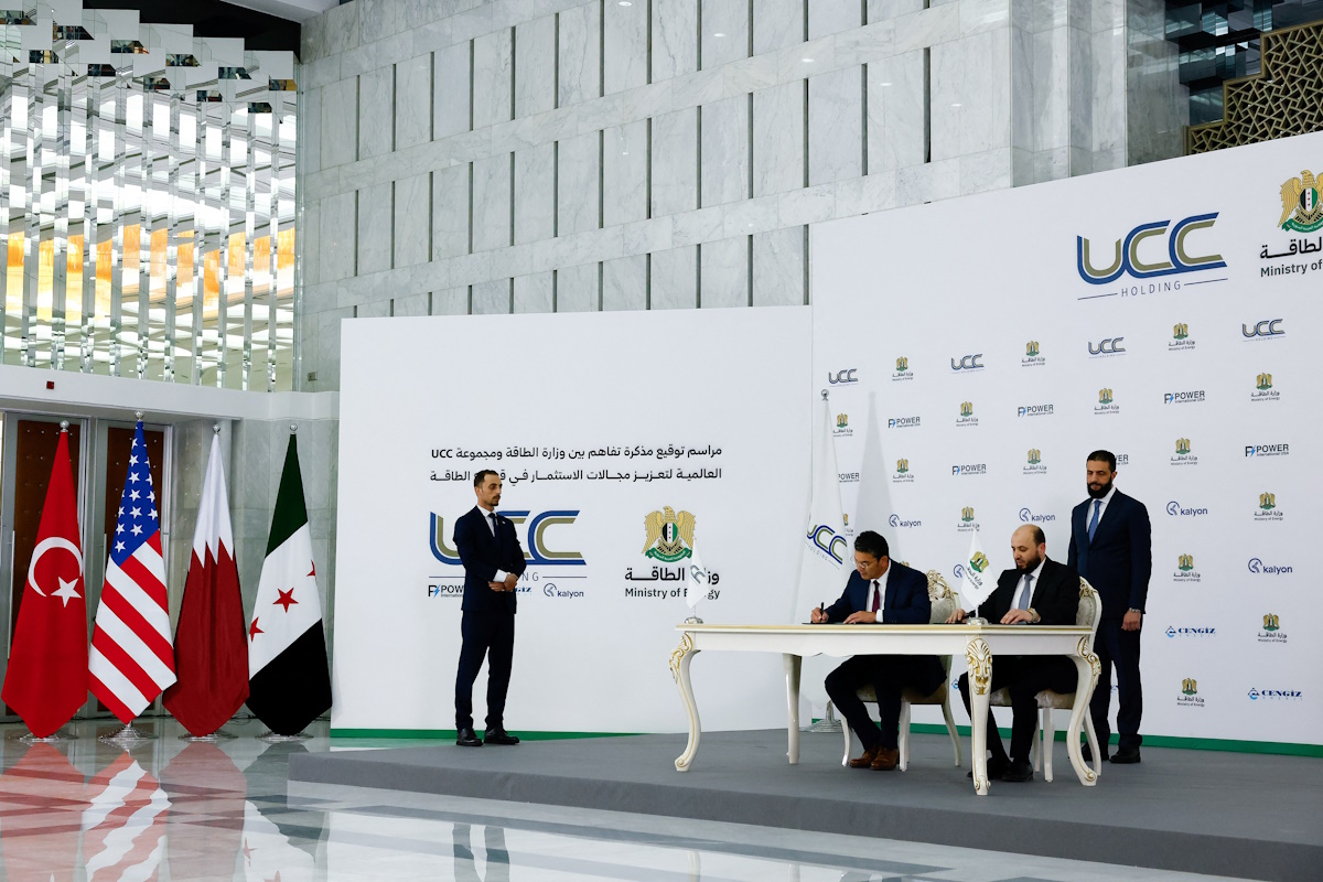 Syrian President Ahmed al-Sharaa attends the signing ceremony of a memorandum of understanding between the Ministry of Energy and Qatar's UCC Holding, with the aim of promoting investment in the energy sector, in Damascu