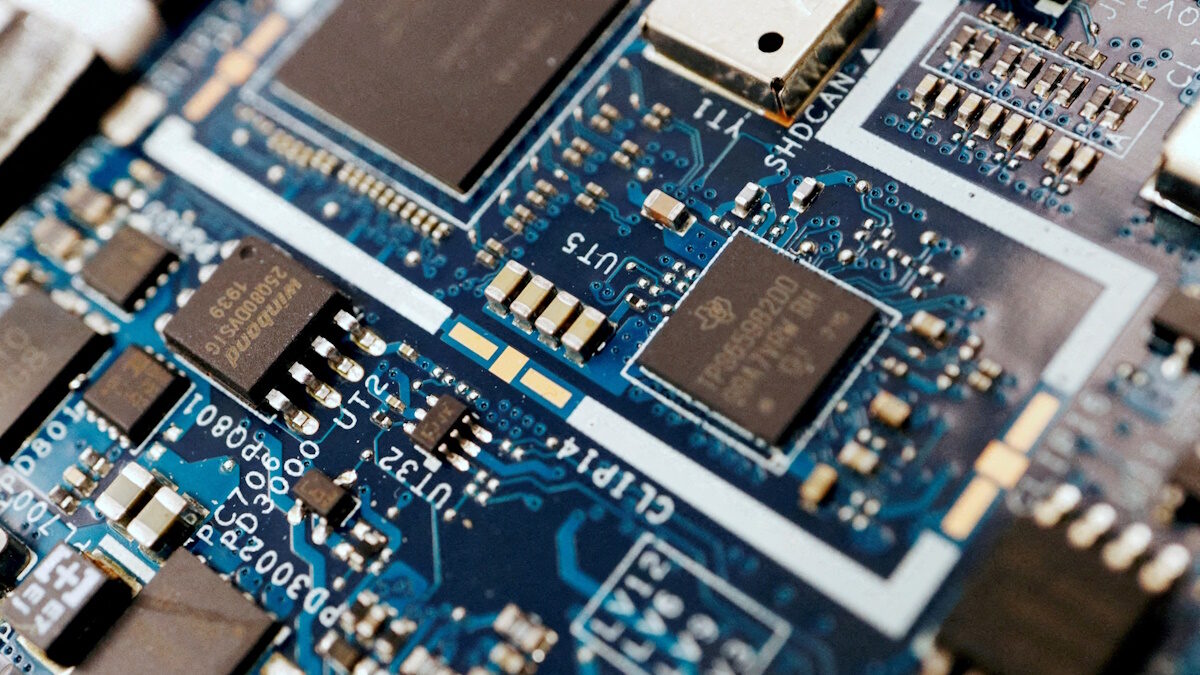 Semiconductor chips are seen on a circuit board of a computer