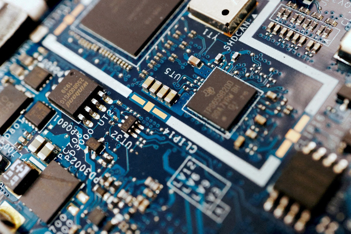 Semiconductor chips are seen on a circuit board of a computer