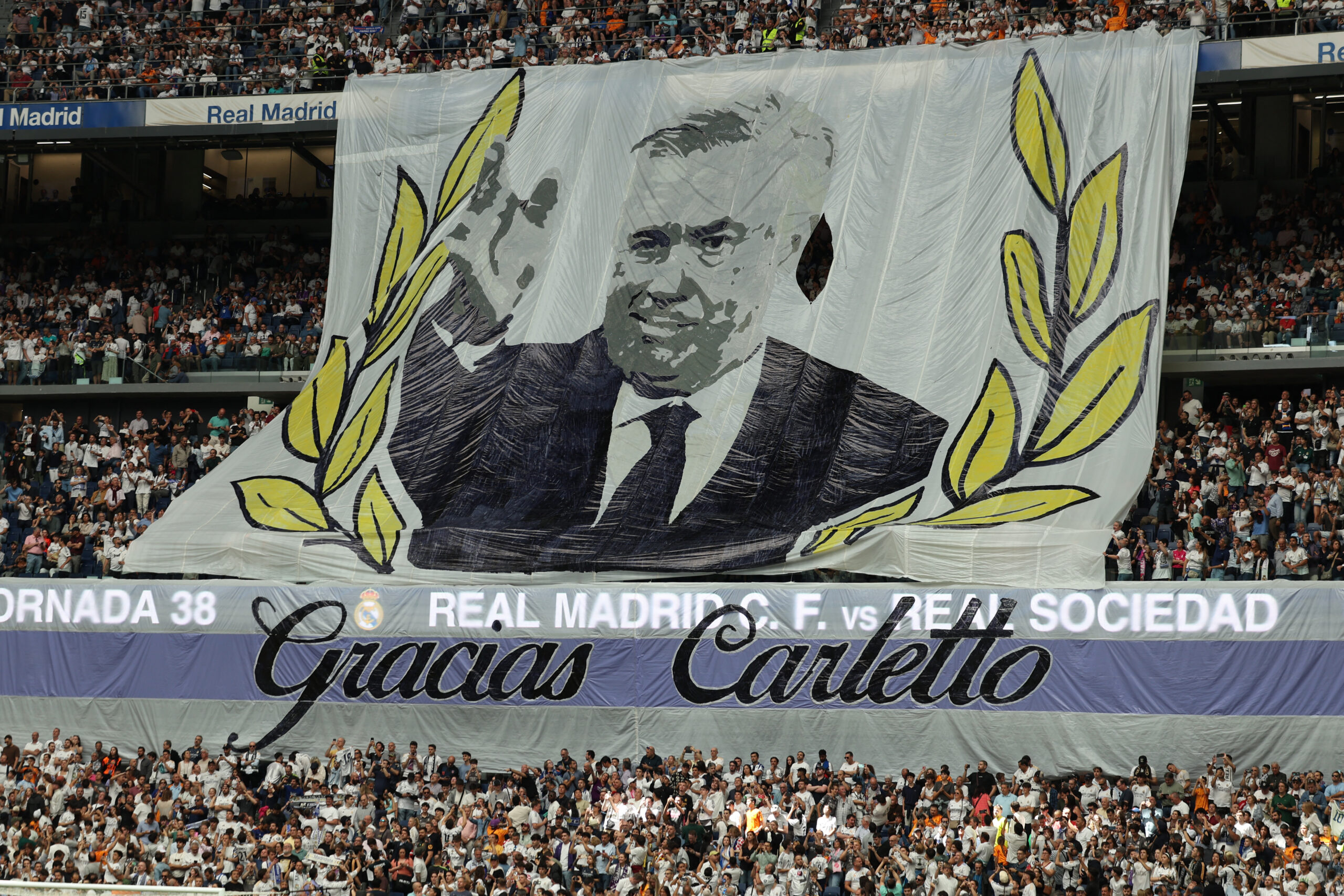 Soccer Football - LaLiga - Real Madrid v Real Sociedad - Santiago Bernabeu, Madrid, Spain - May 24, 2025 A banner is displayed by fans for Real Madrid coach Carlo Ancelotti ahead of his last match as Real Madrid coach REUTERS