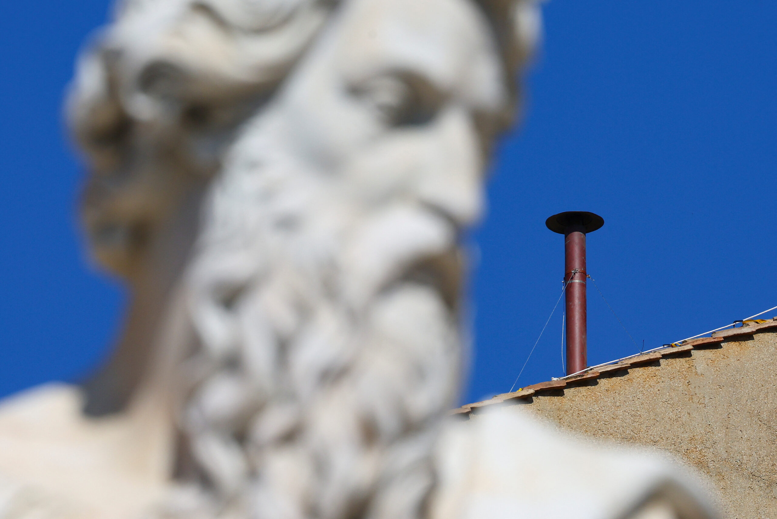 The red chimney in the Sistine hats