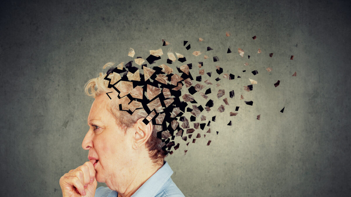 Memory loss due to dementia. Senior woman losing parts of head feeling confused as symbol of decreased mind function.