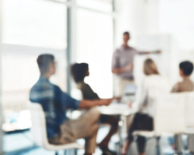 Defocused shot of a group of businesspeople having a meeting in an office