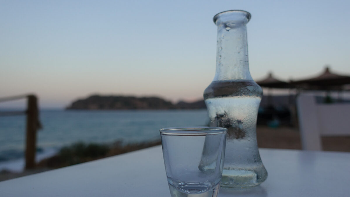 Raki is a sweetened, often anise-flavoured, alcoholic drink that is popular in Albania, Turkic countries, Turkey, Greek Islands and in the Balkan countries as an apéritif. It is often served with seafood or meze. It is comparable to several other alcoholic beverages available around the Mediterranean and the Middle East, e.g. pastis, ouzo, sambuca, arak and aguardiente. In Crete tsikoudia is a pomace brandy that is sometimes called rakı but made from grapes. It is used to make rakomelo, which is flavored with honey and cinnamon. Rakomelo is served warm during winter months.