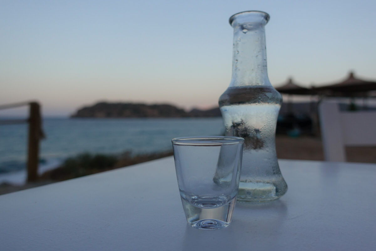 Raki is a sweetened, often anise-flavoured, alcoholic drink that is popular in Albania, Turkic countries, Turkey, Greek Islands and in the Balkan countries as an apéritif. It is often served with seafood or meze. It is comparable to several other alcoholic beverages available around the Mediterranean and the Middle East, e.g. pastis, ouzo, sambuca, arak and aguardiente. In Crete tsikoudia is a pomace brandy that is sometimes called rakı but made from grapes. It is used to make rakomelo, which is flavored with honey and cinnamon. Rakomelo is served warm during winter months.