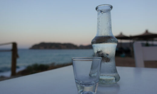 Raki is a sweetened, often anise-flavoured, alcoholic drink that is popular in Albania, Turkic countries, Turkey, Greek Islands and in the Balkan countries as an apéritif. It is often served with seafood or meze. It is comparable to several other alcoholic beverages available around the Mediterranean and the Middle East, e.g. pastis, ouzo, sambuca, arak and aguardiente. In Crete tsikoudia is a pomace brandy that is sometimes called rakı but made from grapes. It is used to make rakomelo, which is flavored with honey and cinnamon. Rakomelo is served warm during winter months.