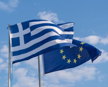 The national flag of Greece and the flag of the European Union