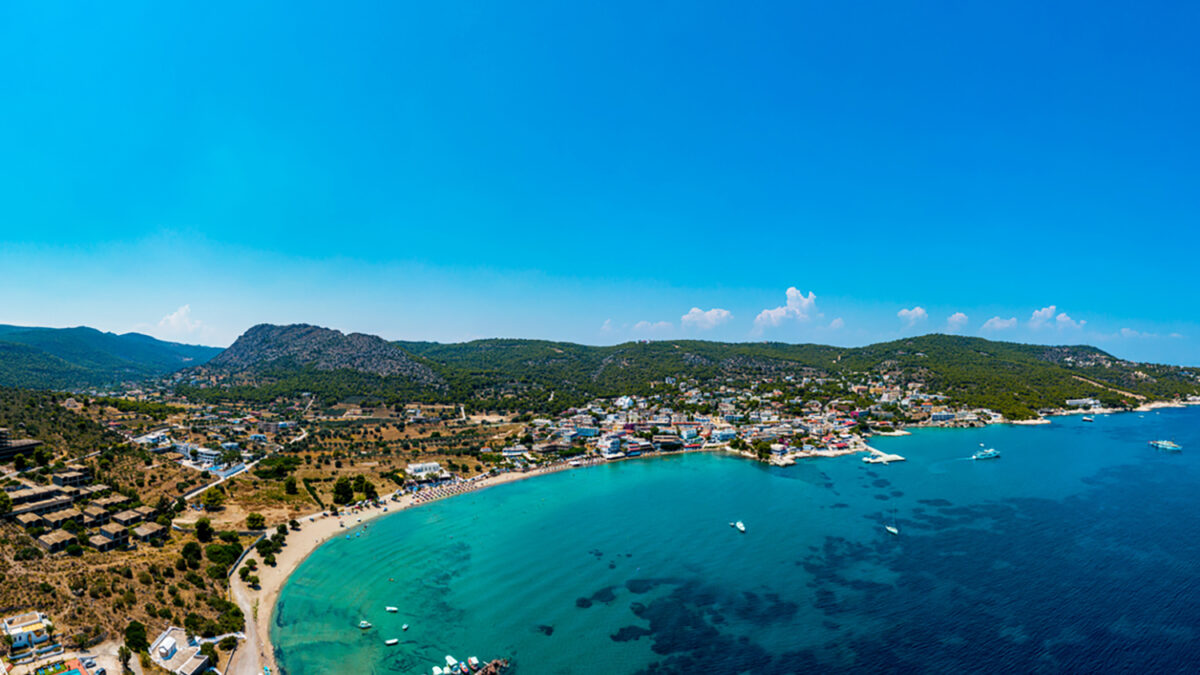 Aegina, Egina, aerial panoramic photo of the town, port and beach of Agia Marina at summer