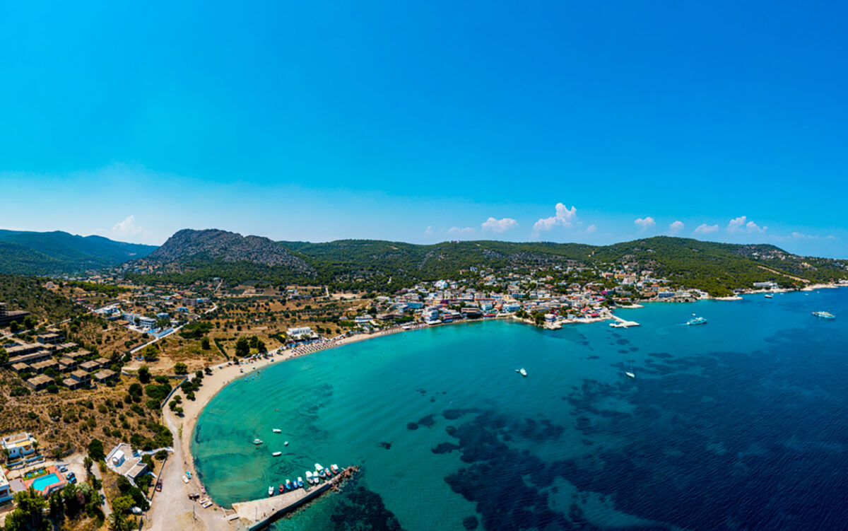 Aegina, Egina, aerial panoramic photo of the town, port and beach of Agia Marina at summer
