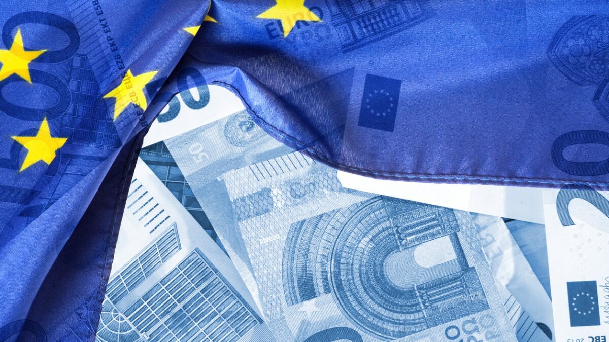 Flag of the European Union EU and euro banknotes