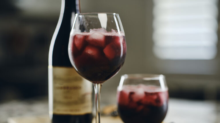 A closeup of a glass of a chilled wine that is served over ice