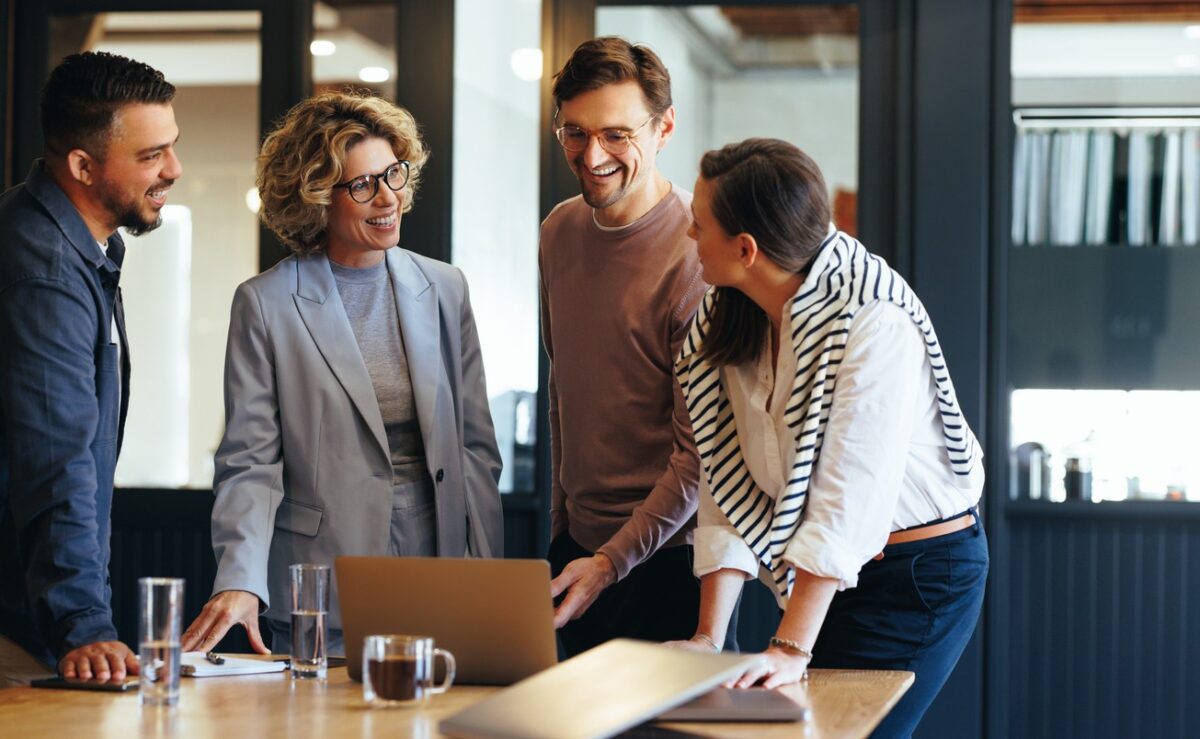 Group of business people having a meeting in a tech company. Creative business professionals planning a project in an office. Teamwork and collaboration in a modern workplace