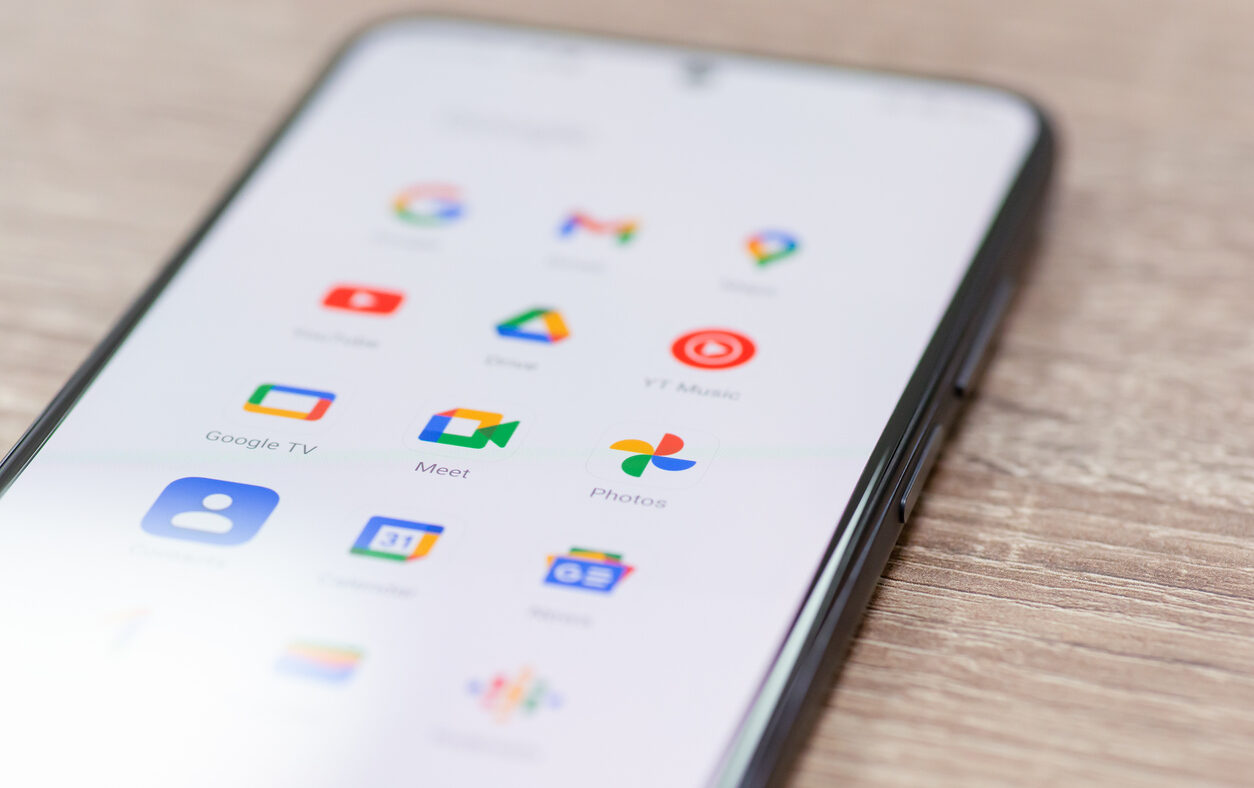 Chernihiv, Ukraine - December 22, 2022: Screen of smartphone with icons of Google apps grouped together. Close up shot of icons on mobile phone, global information sharing