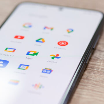 Chernihiv, Ukraine - December 22, 2022: Screen of smartphone with icons of Google apps grouped together. Close up shot of icons on mobile phone, global information sharing
