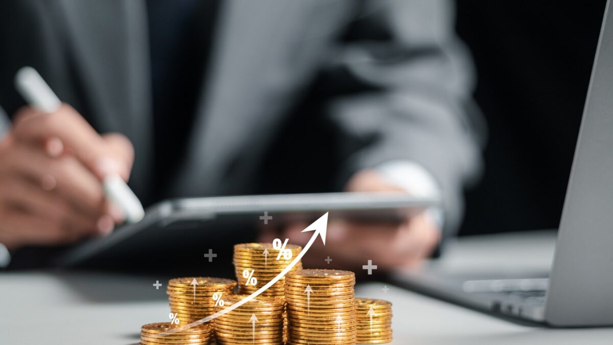 Businessman collecting coins with profit chart analysis business growth, profit growth management and corporate financial statistics