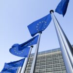 European Union flags in front of the Berlaymont building in Brussels, Belgium
