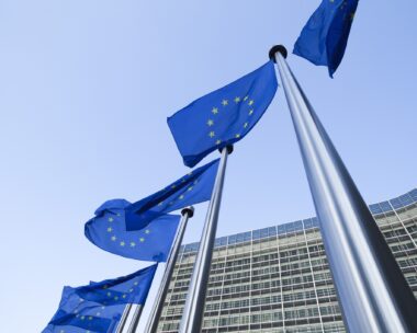 European Union flags in front of the Berlaymont building in Brussels, Belgium