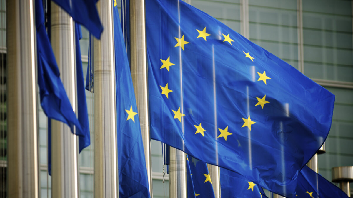 "EU flags fly in a row in front of the European Commission building in Brussels, Belgium"