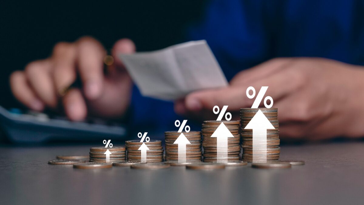 Increased product sales growth basket growth, market or consumer price index concept shopping cart with food increase with arrow graph on the coin inflation VAT