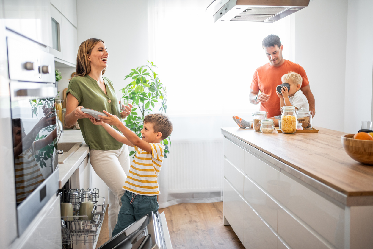 A happy family in their new kitchen. This picture brings to life the warmth and joy of a family moment in their new home
