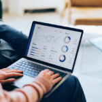 Focused on a laptop, showcasing detailed analytics and reports