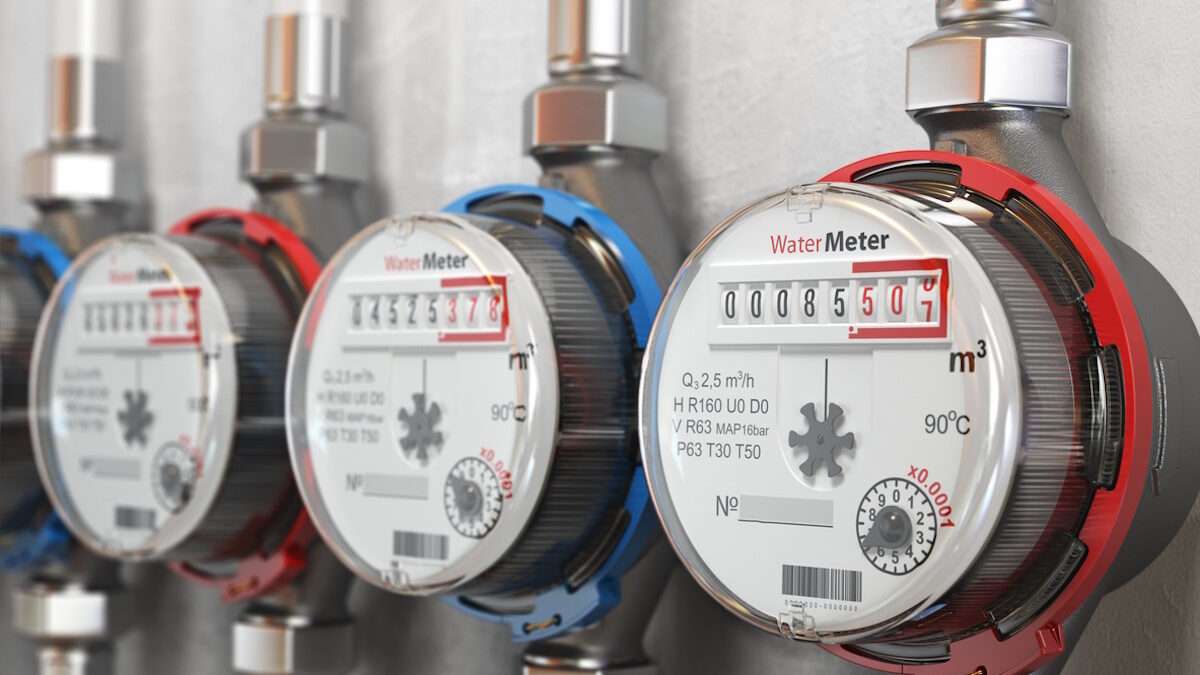 Row of water meters of cold and hot water on the wall