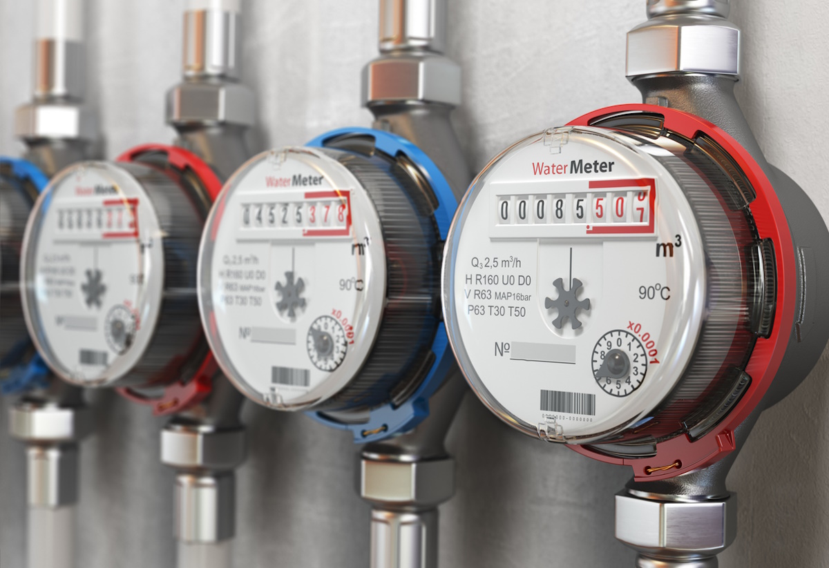 Row of water meters of cold and hot water on the wall