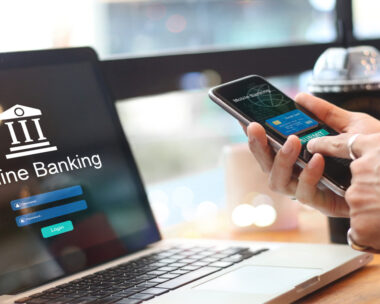 Man using online banking with credit card on touch screen device. Mobile banking. Digital and internet payments shopping on network connection. Bank login on a laptop screen. All on screen and credit card are design up