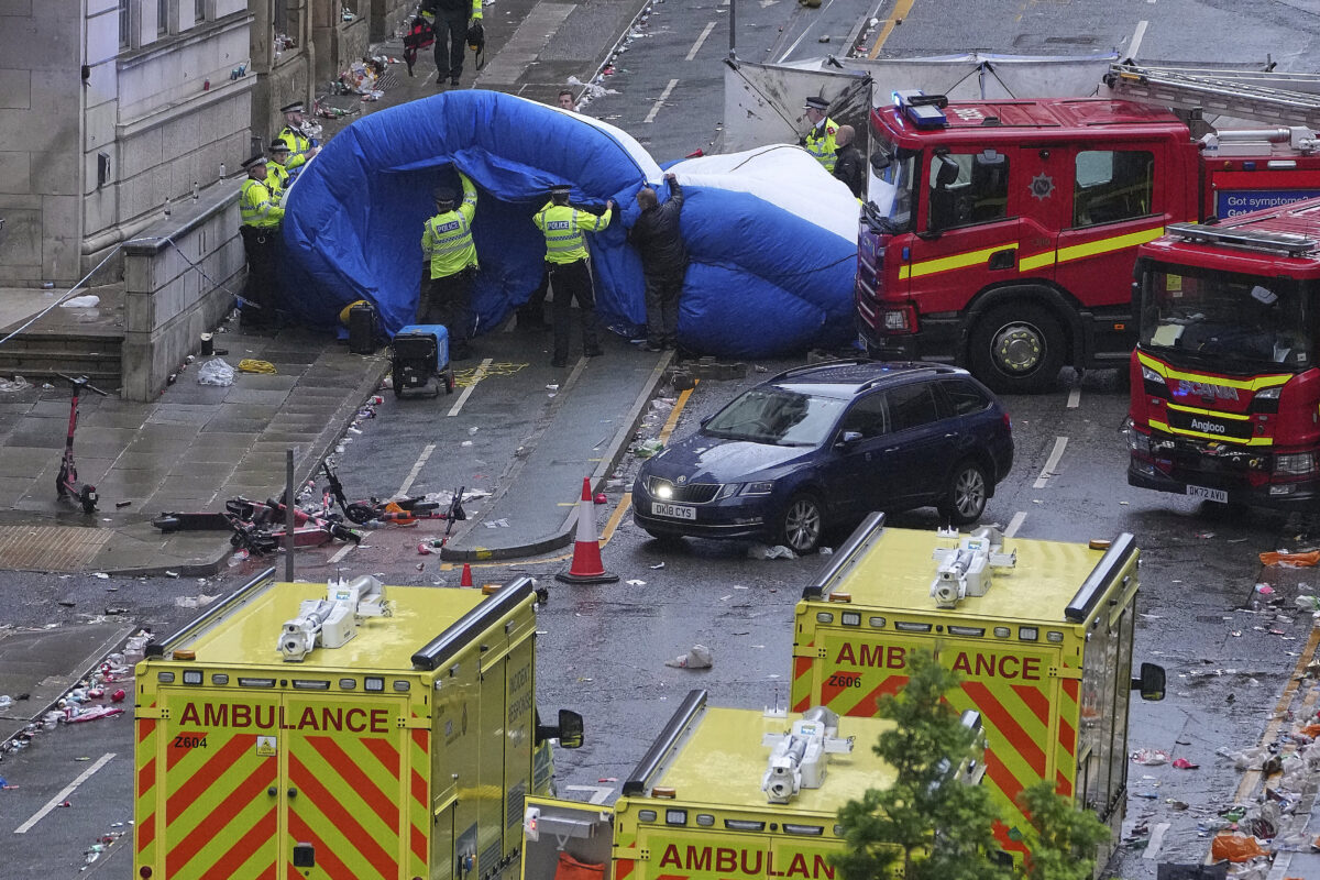 Police, ambulances, firefighting vehicles and 53 -year -old's black car in downtown Liverpool