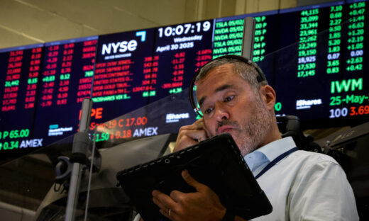 Traders work on the floor of the NYSE in New York
