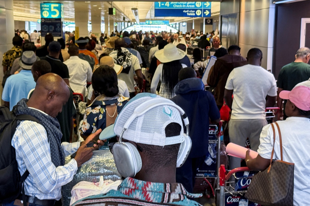 Passengers queue at Dubai International Airport, following Iran Monday's attack on a U.S. military base, in Dubai, United Arab Emirates, June 24, 2025. REUTERS