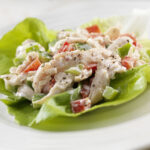 A Creamy Chicken Salad Lettuce Wrap with Red and Green Peppers- Photographed on Hasselblad H3D2-39mb Camera