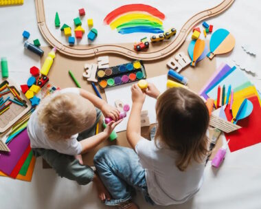 Children drawing and making crafts in kindergarten or daycare