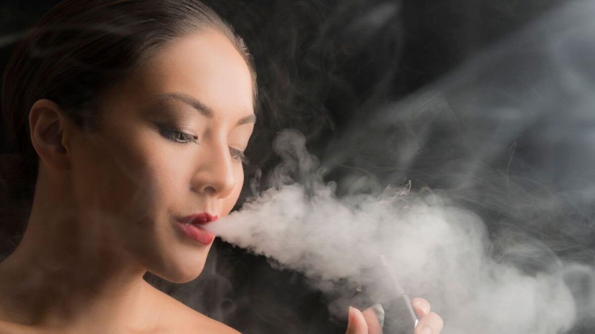 Woman Smoking an E-Cigarette.