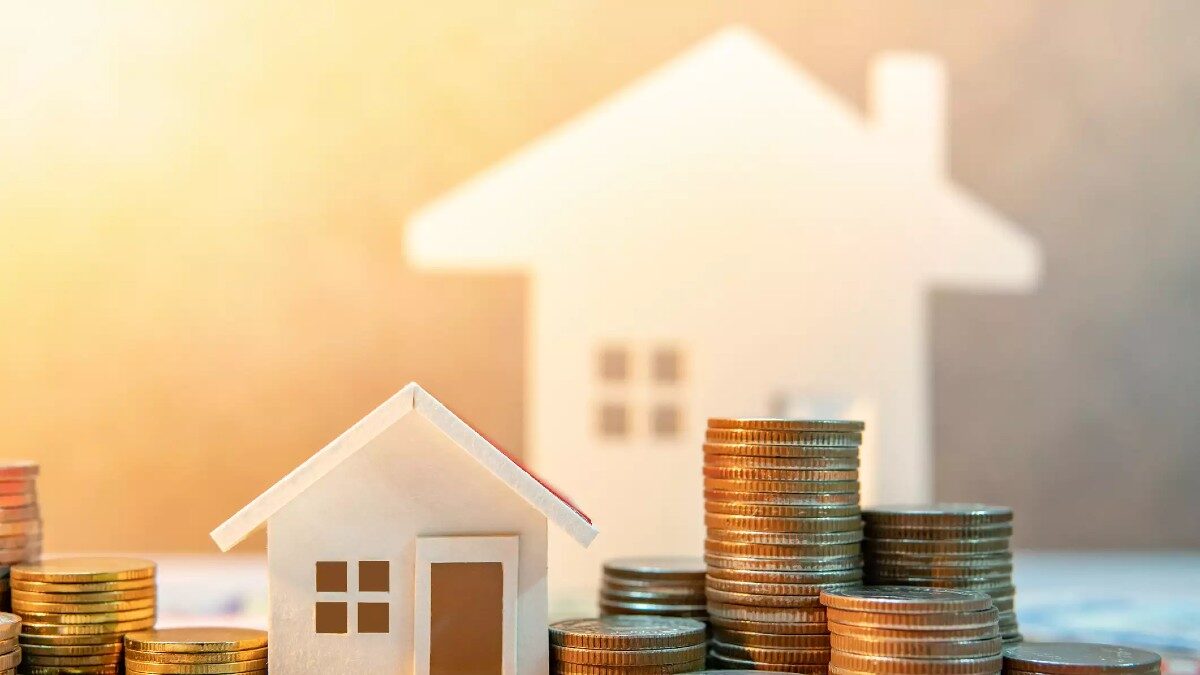 Real estate or property investment. Home mortgage loan rate. Saving money for retirement concept. Coin stack on international banknotes with house model on table. Business growth background