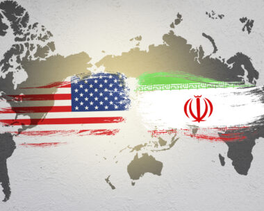 USA and Iran flag on world map. United state of America and Iran have conflict in nuclear weapons and Strait of Hormuz