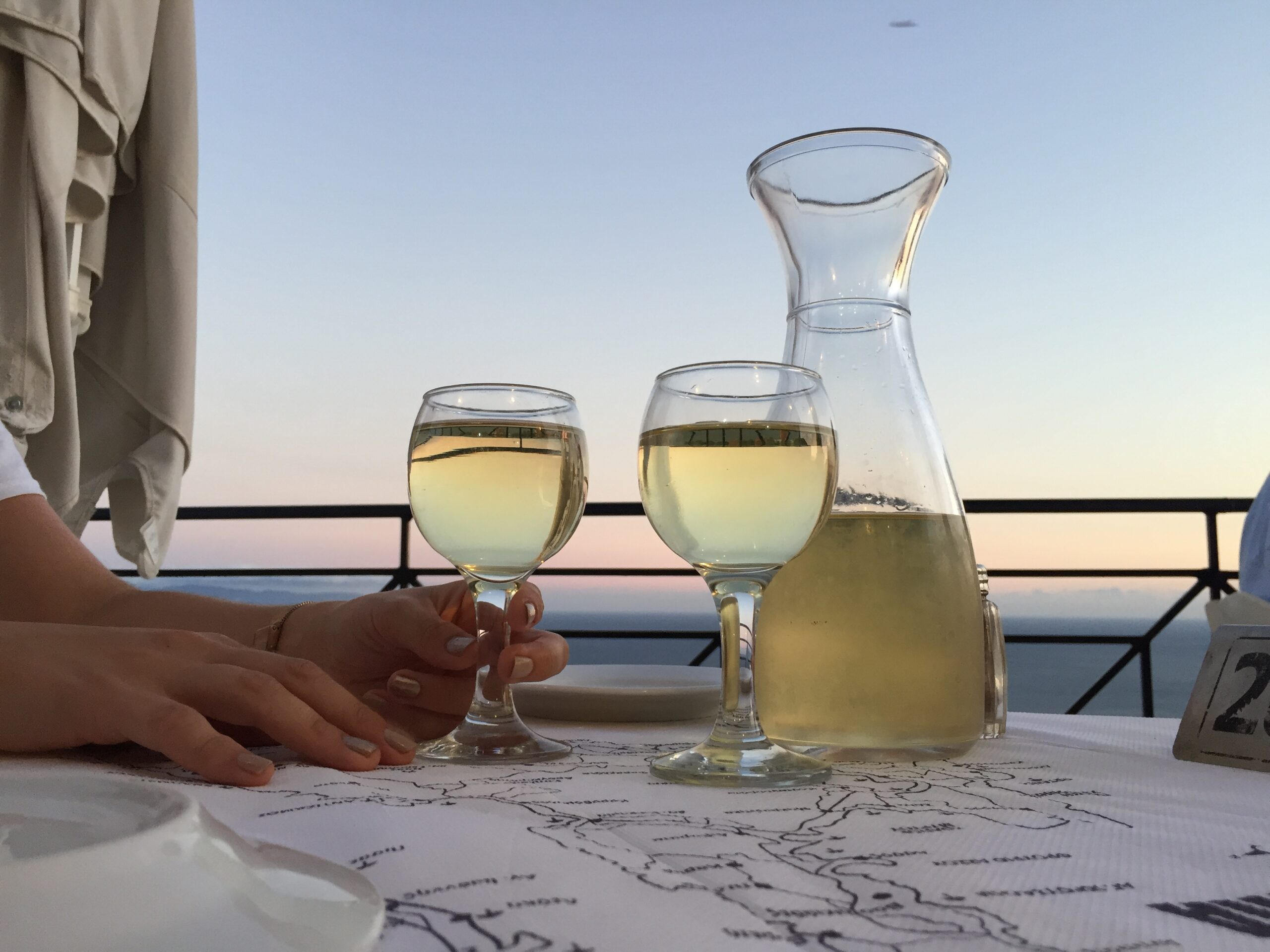 Tasting Local Greek wine while the sunsets in the back ground