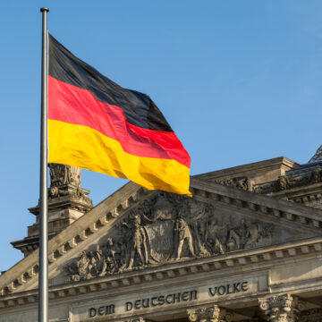 German flag fluttering front of Reichstag building