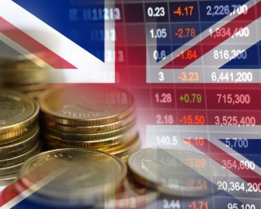 Stock market investment trading financial, coin and UK United Kingdom flag or Forex for analyze profit finance business trend data