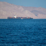 Iranian coastline near the Strait of Hormuz. giant sea container ship in the strait of Hormuz. Near East
