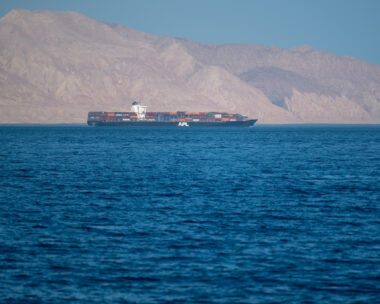 Iranian coastline near the Strait of Hormuz. giant sea container ship in the strait of Hormuz. Near East