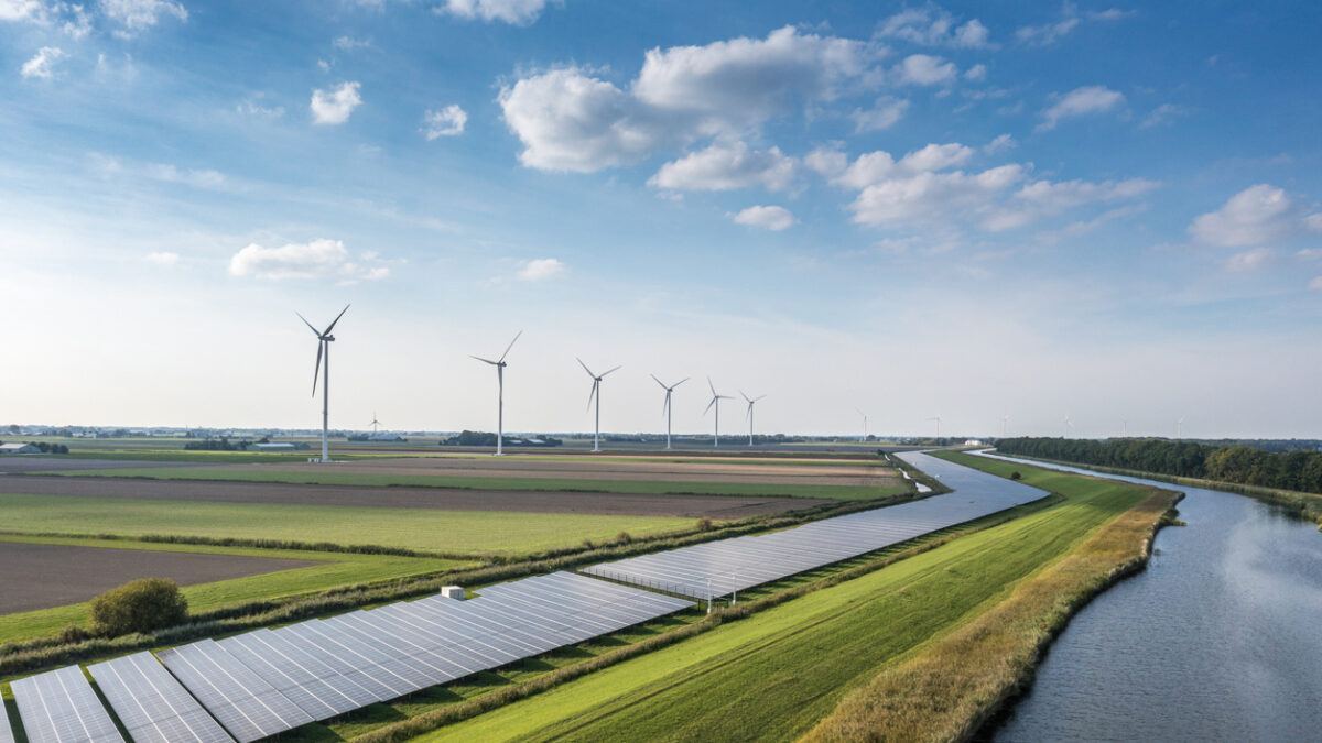 Solar panels and wind turbines generating renewable energy for green and sustainable future