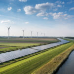 Solar panels and wind turbines generating renewable energy for green and sustainable future