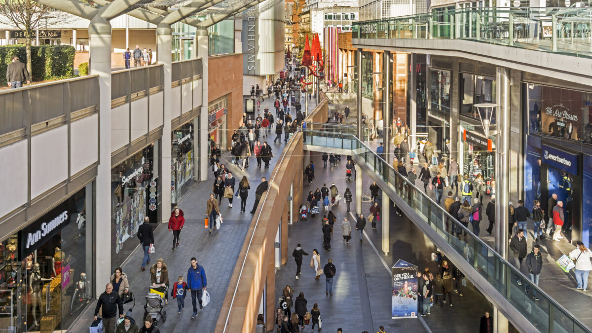 View of a busy shopping street in the centre of Liverpool, UK Shops can be seen on either side of the photograph and people can be seen walking on the pavements