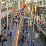 View of a busy shopping street in the centre of Liverpool, UK Shops can be seen on either side of the photograph and people can be seen walking on the pavements